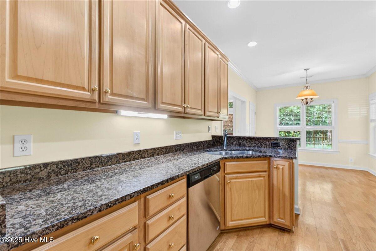 8985 Woodbine Road Southwest Sunset Beach, NC 28468 - Photo 24 of 65 Kitchen with spacious countertops, dishwasher, and ample cabinet space