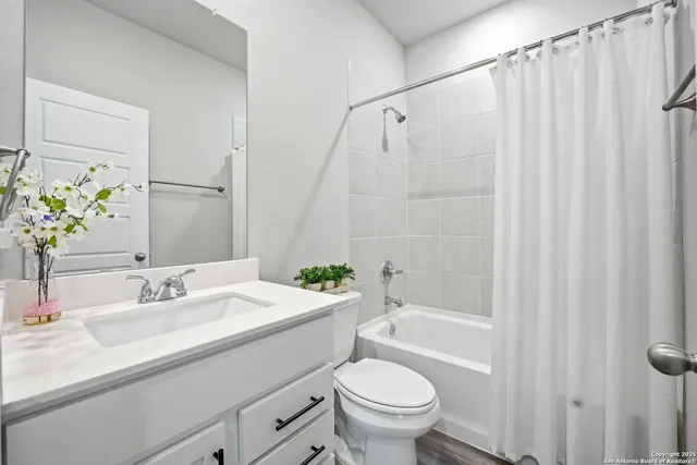 a bathroom with a sink a toilet and a bathtub