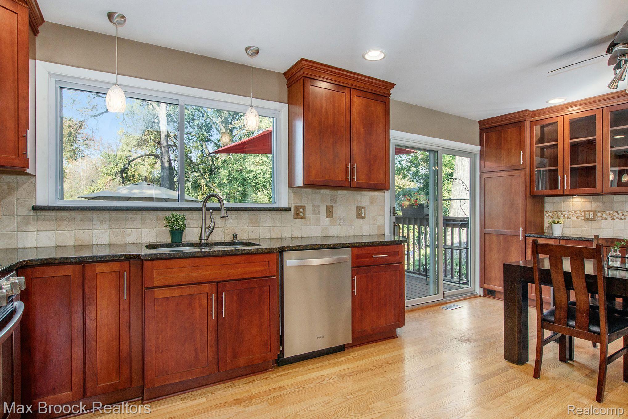 954 Hadley Road Rochester, MI 48307 - Photo 6 of 43 Newer Kitchen with brown cherry cabinets & granite