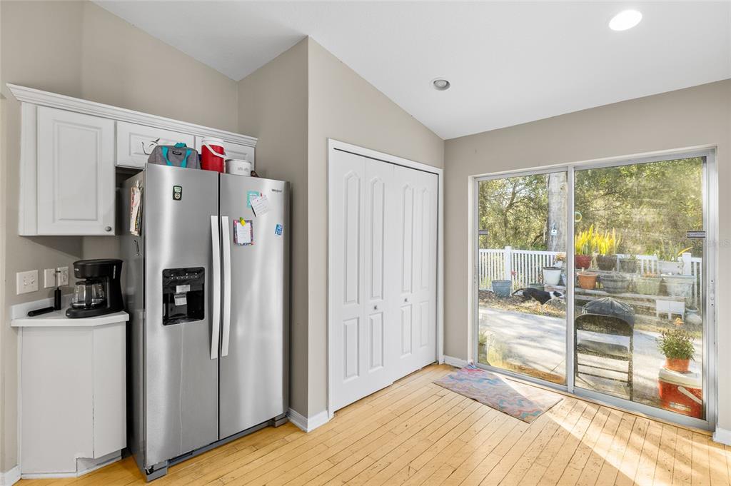 12113 Deertrack Loop Spring Hill, FL 34610 - Photo 13 of 31 a view of a kitchen with refrigerator and cabinet