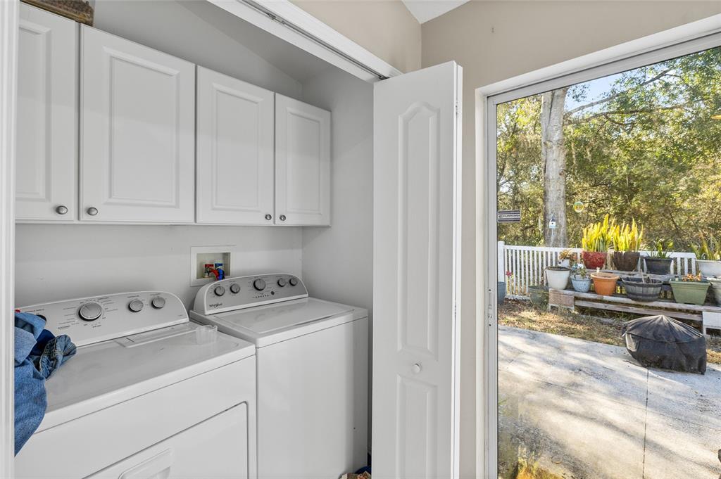 12113 Deertrack Loop Spring Hill, FL 34610 - Photo 15 of 31 a view of utility room and washer and dryer