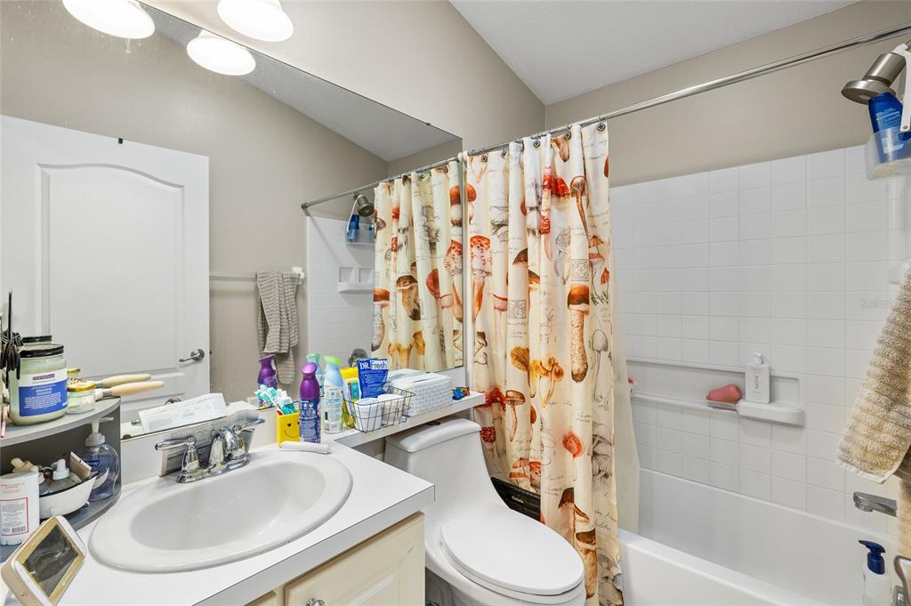 12113 Deertrack Loop Spring Hill, FL 34610 - Photo 20 of 31 a bathroom with a sink toilet and shower