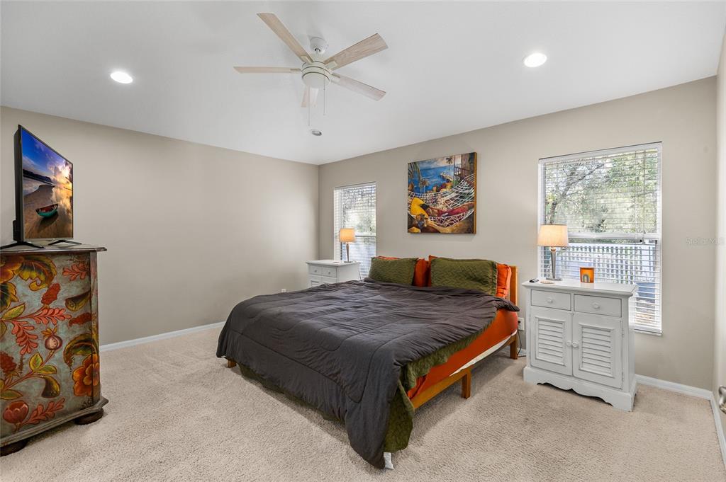 12113 Deertrack Loop Spring Hill, FL 34610 - Photo 4 of 31 a bedroom with a bed and a flat screen tv