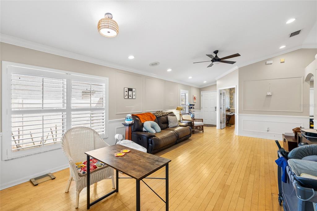 12113 Deertrack Loop Spring Hill, FL 34610 - Photo 7 of 31 a living room with furniture and a large window
