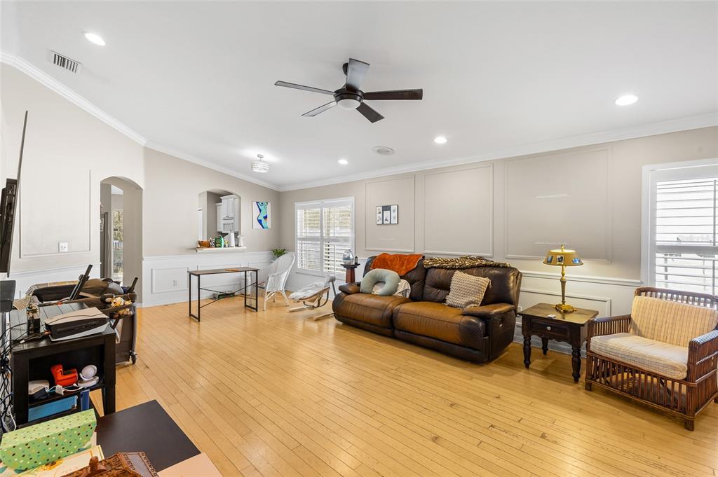 12113 Deertrack Loop Spring Hill, FL 34610 - Photo 9 of 31 a living room with furniture and a wooden floor