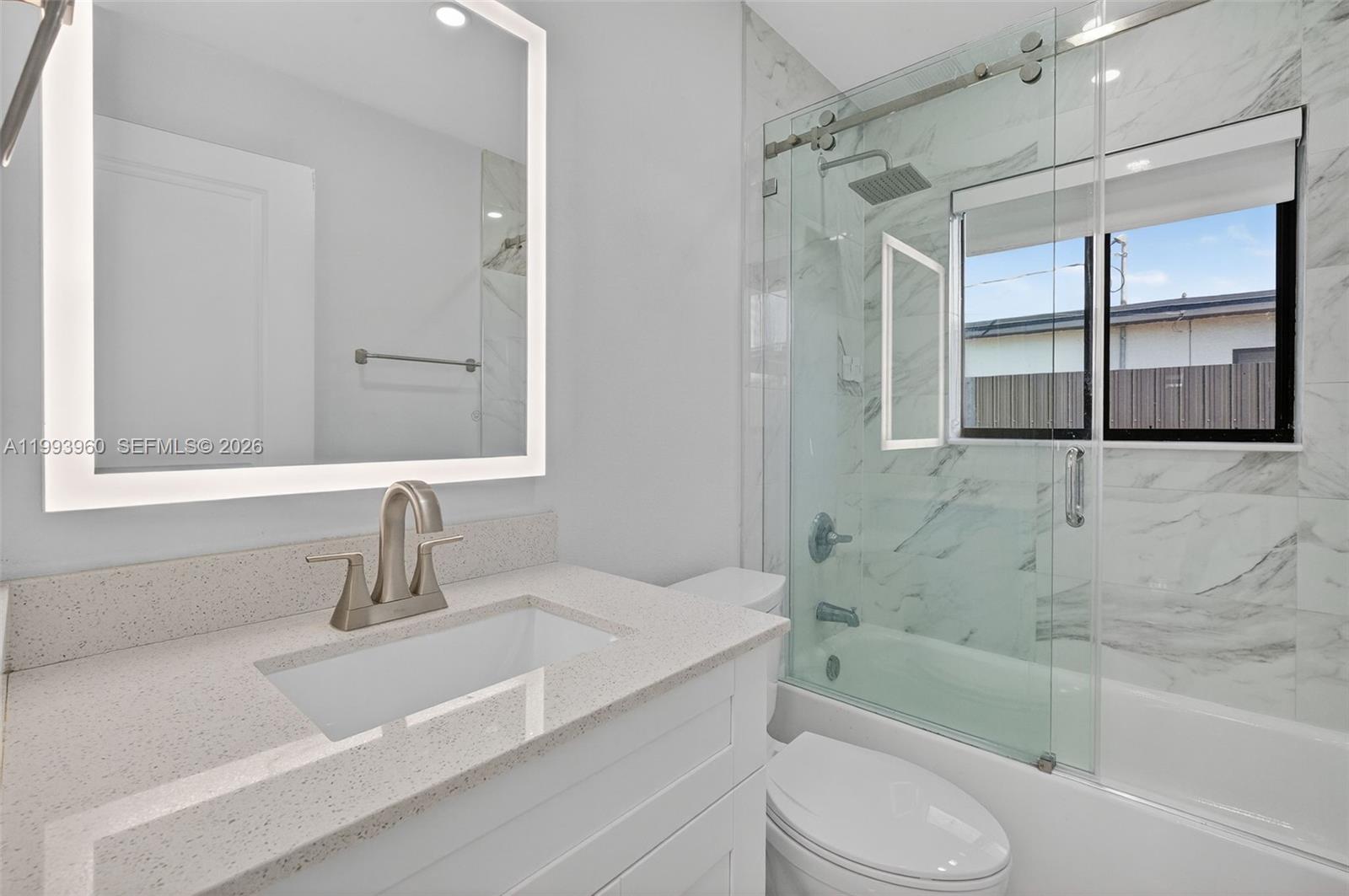 2492 Southwest 44th Street, Unit 2492 Miami, FL 33185 - Photo 19 of 34 a bathroom with a sink toilet and shower