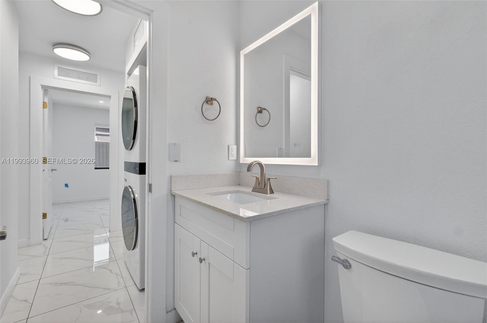 2492 Southwest 44th Street, Unit 2492 Miami, FL 33185 - Photo 20 of 34 a bathroom with a sink toilet and shower