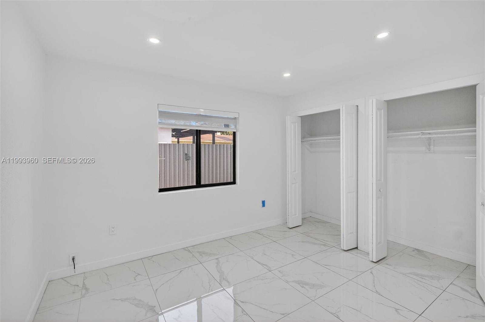 2492 Southwest 44th Street, Unit 2492 Miami, FL 33185 - Photo 21 of 34 a view of an empty room with a window