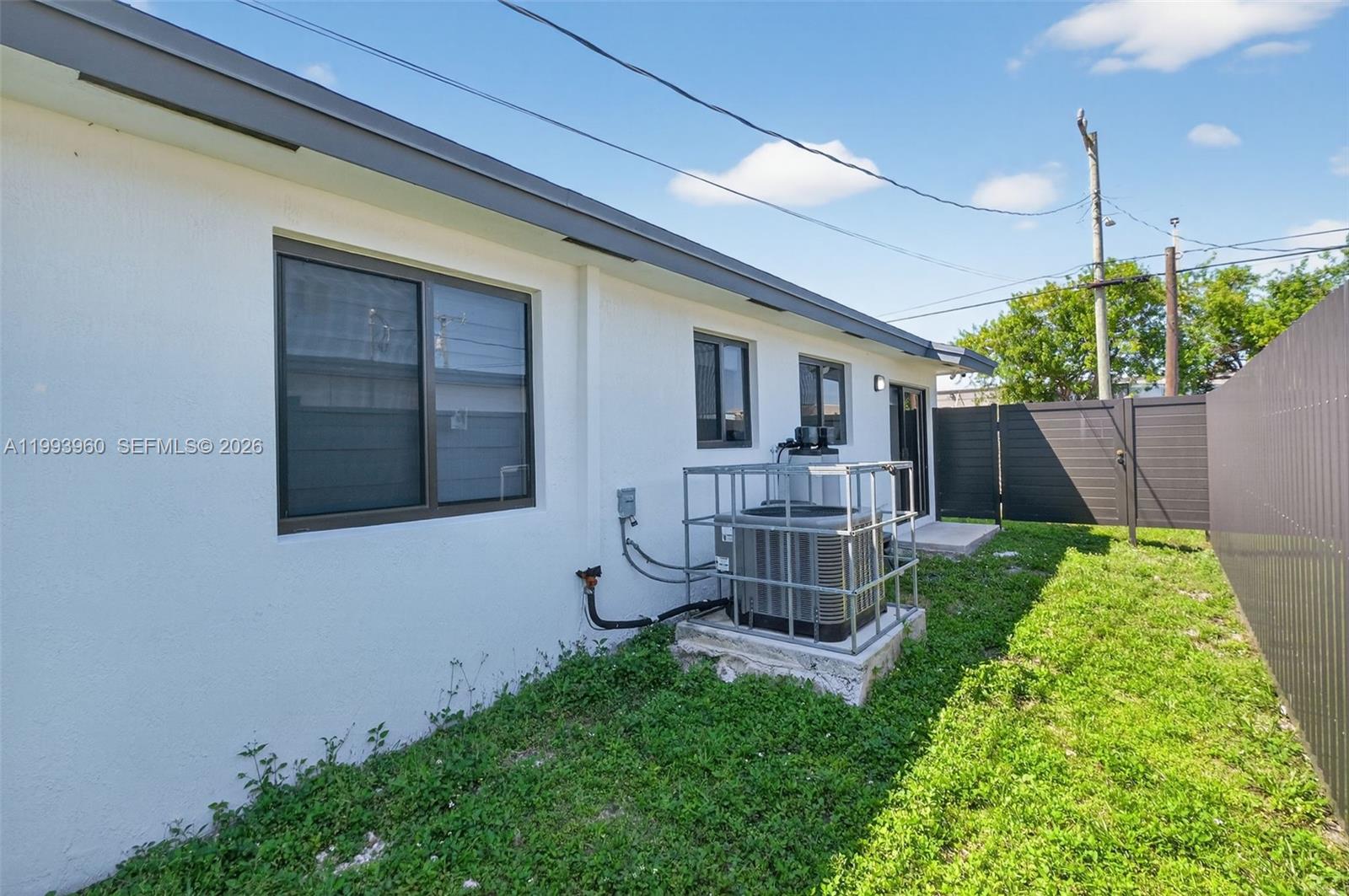 2492 Southwest 44th Street, Unit 2492 Miami, FL 33185 - Photo 27 of 34 a view of a house with a yard and sitting area