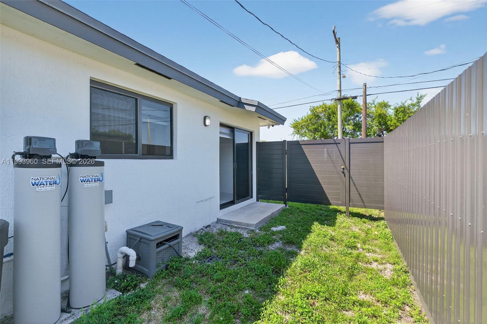 2492 Southwest 44th Street, Unit 2492 Miami, FL 33185 - Photo 28 of 34 a backyard of a house with lots of green space