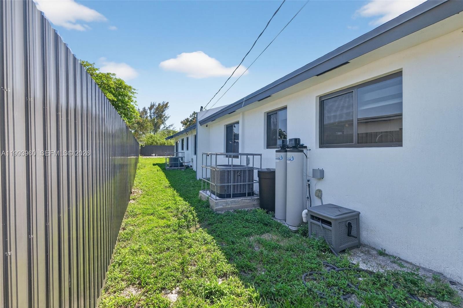 2492 Southwest 44th Street, Unit 2492 Miami, FL 33185 - Photo 30 of 34 a view of a backyard with plants and large tree