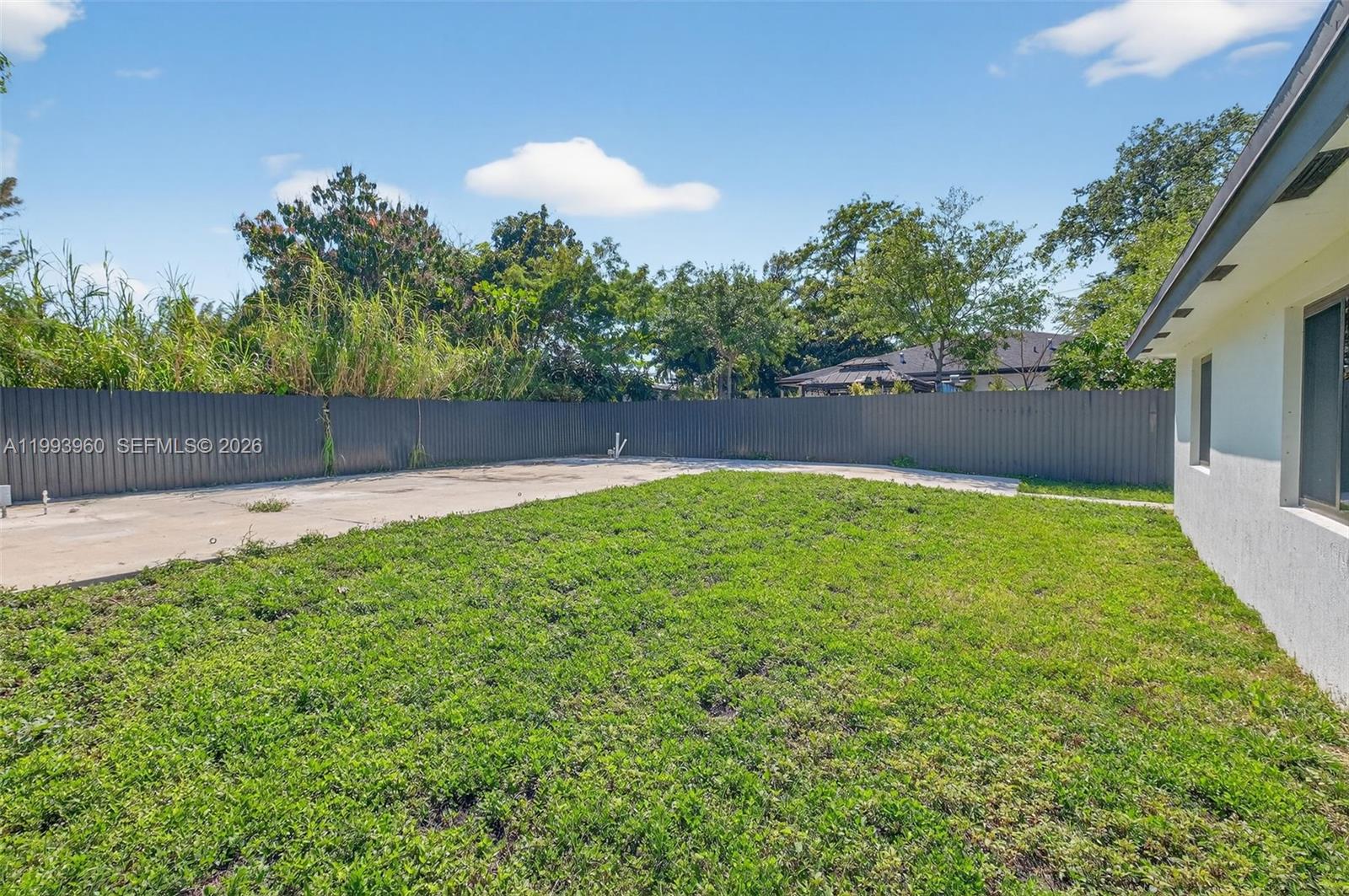 2492 Southwest 44th Street, Unit 2492 Miami, FL 33185 - Photo 31 of 34 a swimming pool with wooden fence