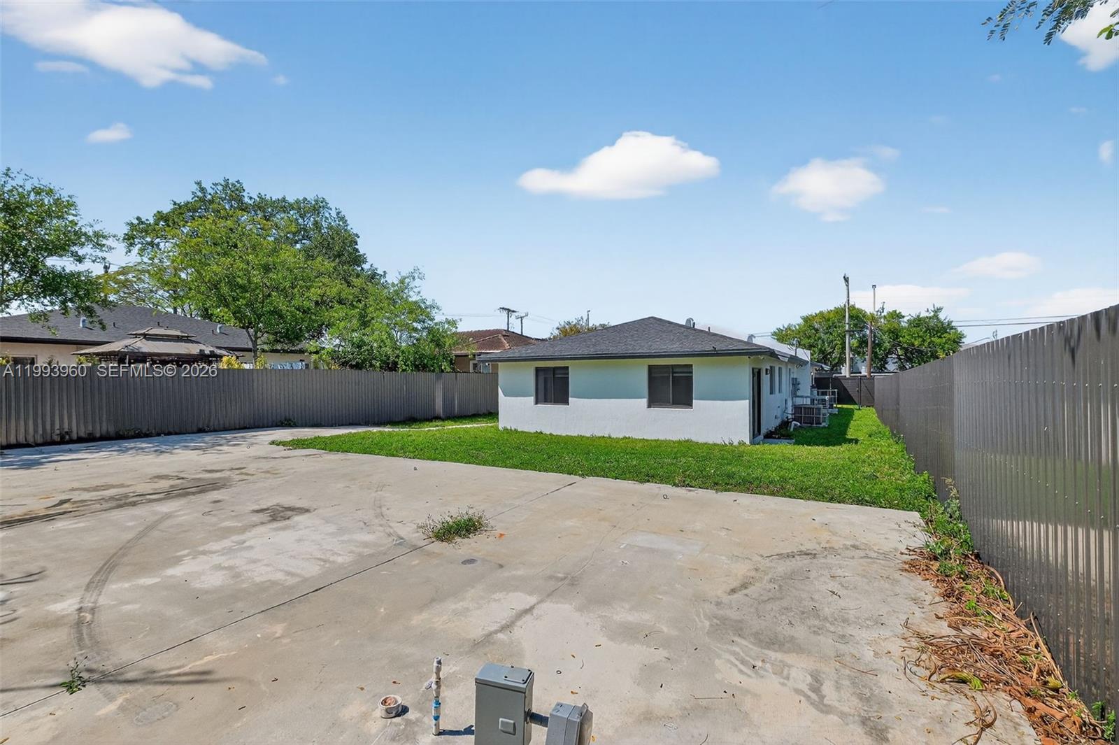 2492 Southwest 44th Street, Unit 2492 Miami, FL 33185 - Photo 33 of 34 a front view of a house with a yard and garage