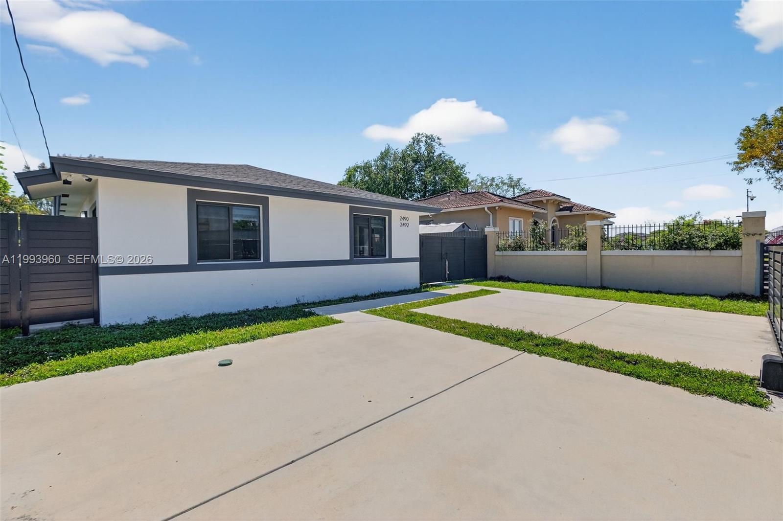 2492 Southwest 44th Street, Unit 2492 Miami, FL 33185 - Photo 6 of 34 a house view with a garden space