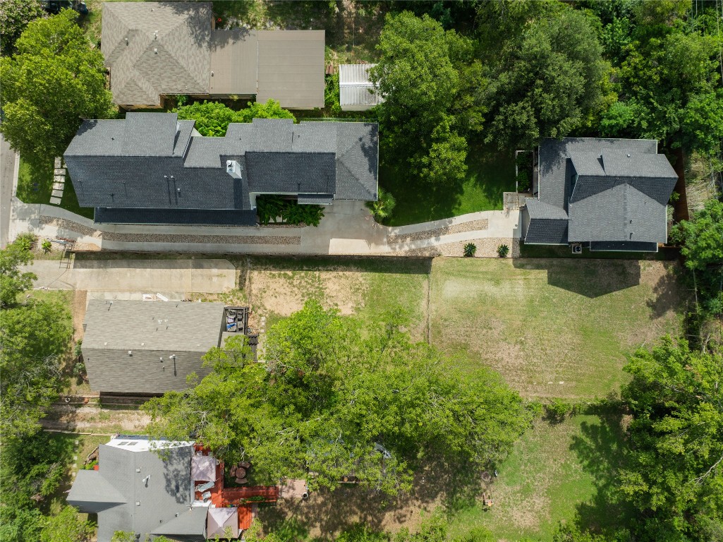 an aerial view of house with yard swimming pool and outdoor seating