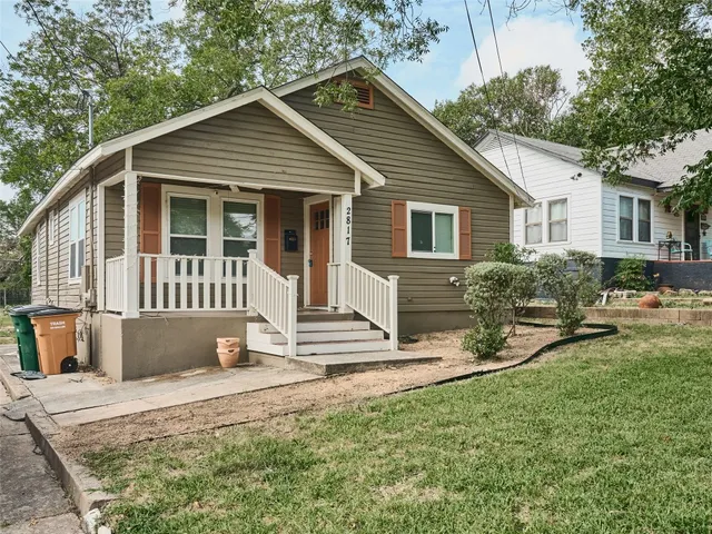 a front view of a house with a yard outdoor seating and yard