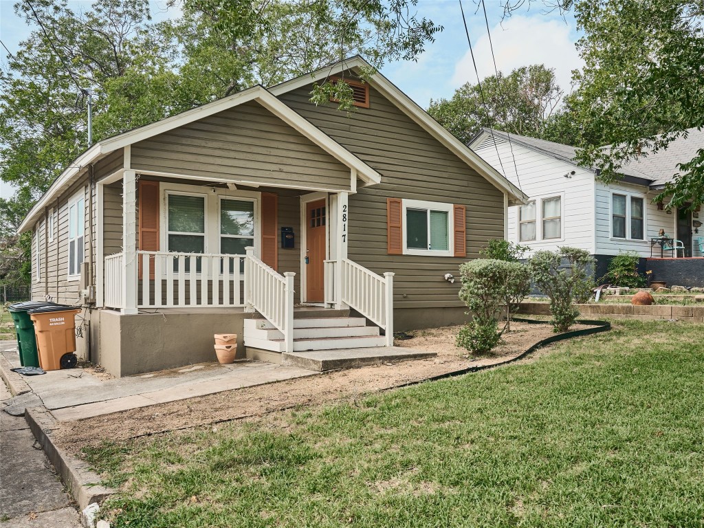 2817 East 22nd Street Austin, TX 78722 - Photo 5 of 18 a front view of a house with a yard outdoor seating and yard
