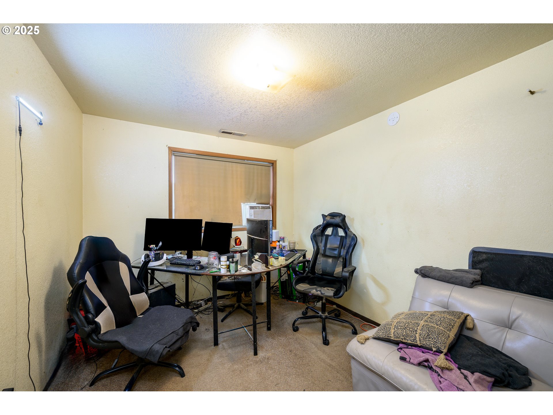 714 South Meridian Street Newberg, OR 97132 - Photo 15 of 35 a living room with furniture and a flat screen tv