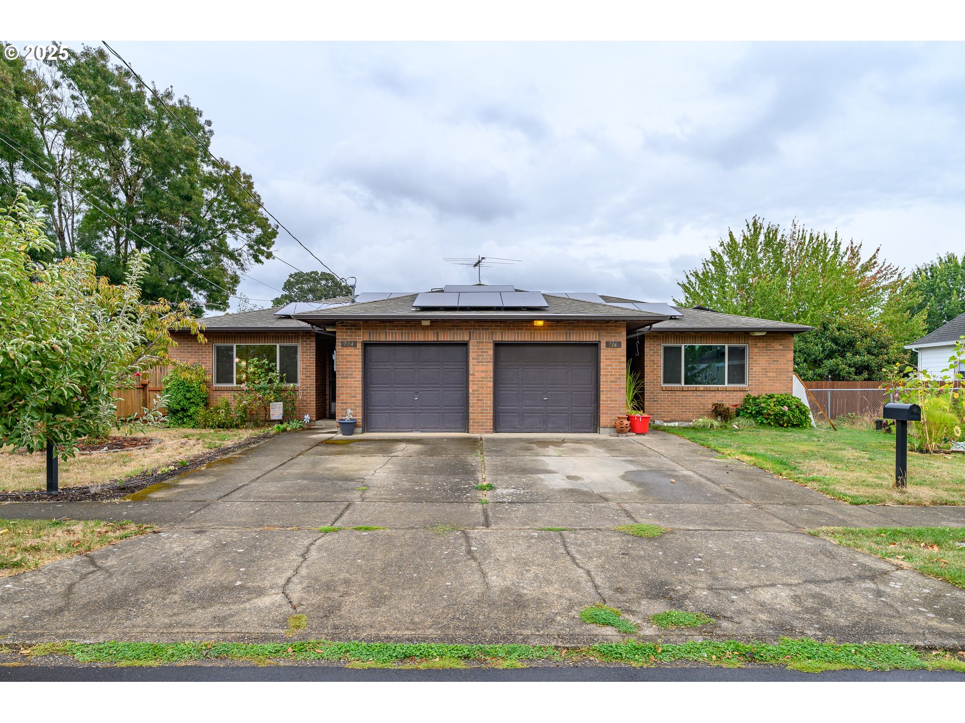 714 South Meridian Street Newberg, OR 97132 - Photo 35 of 35 a front view of a house with a yard and a garage