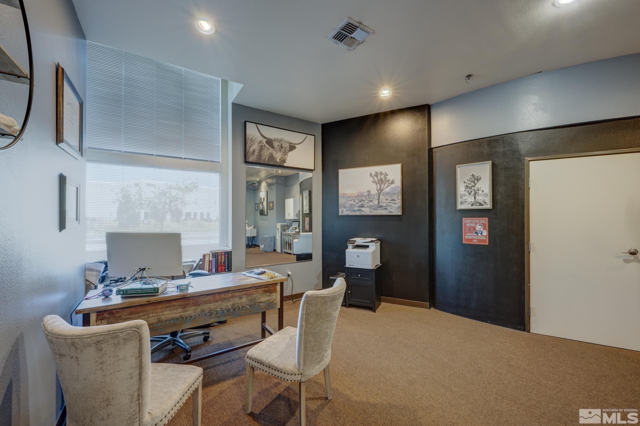 8975 Double Diamond Parkway, Unit 12A Reno, NV 89521 - Photo 2 of 8 a workspace with furniture and window