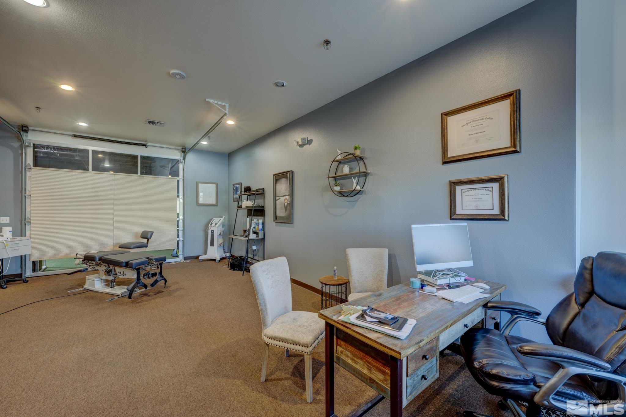 8975 Double Diamond Parkway, Unit 12A Reno, NV 89521 - Photo 3 of 8 a workspace with furniture and rug