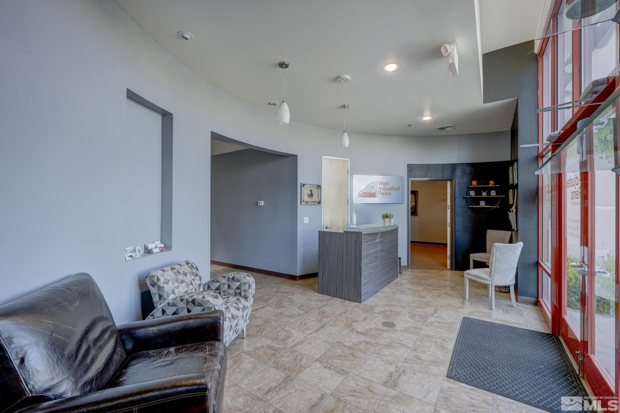 8975 Double Diamond Parkway, Unit 12A Reno, NV 89521 - Photo 6 of 8 a living room with furniture