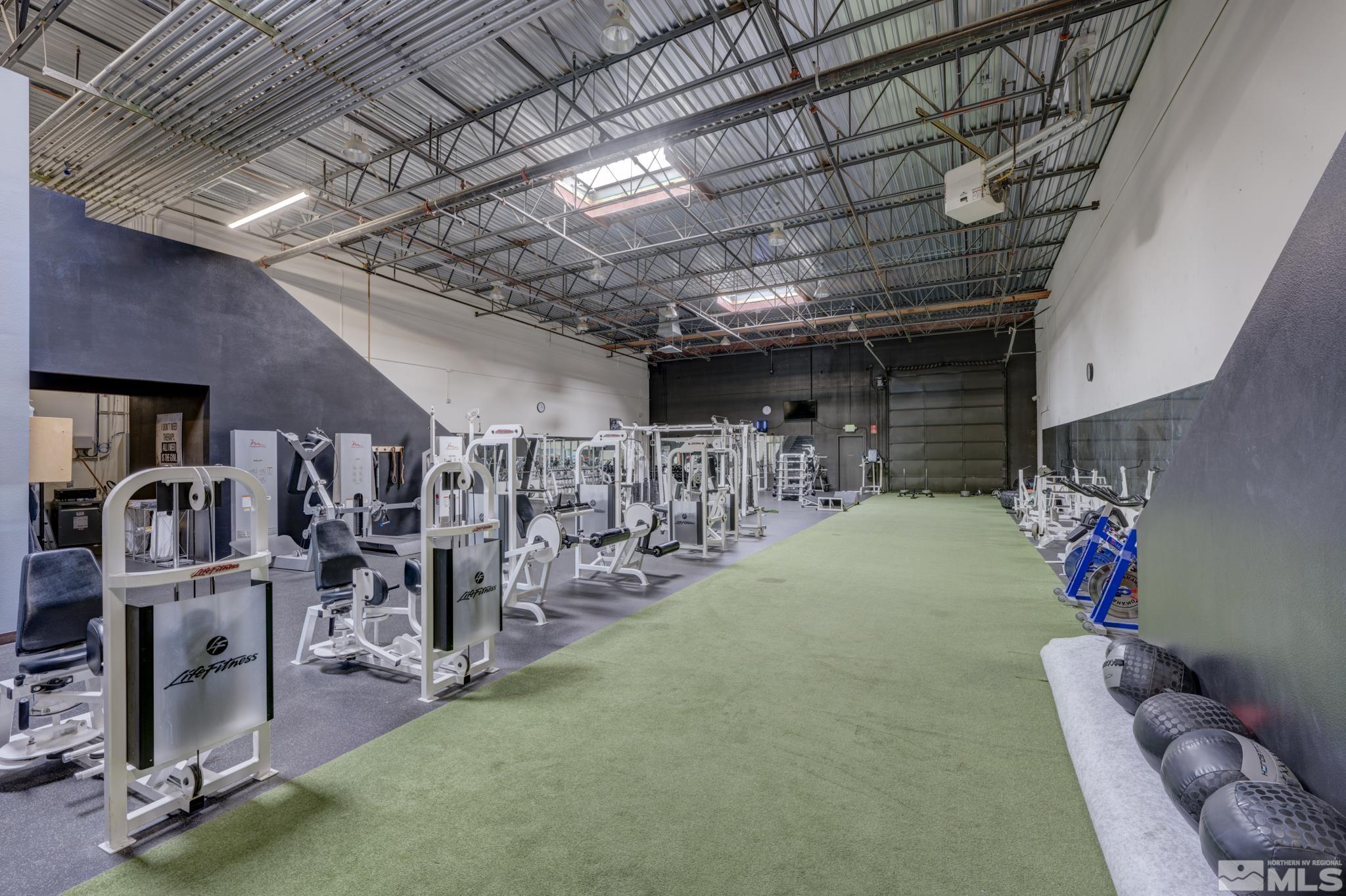 8975 Double Diamond Parkway, Unit 12A Reno, NV 89521 - Photo 7 of 8 a view of a room with gym equipment