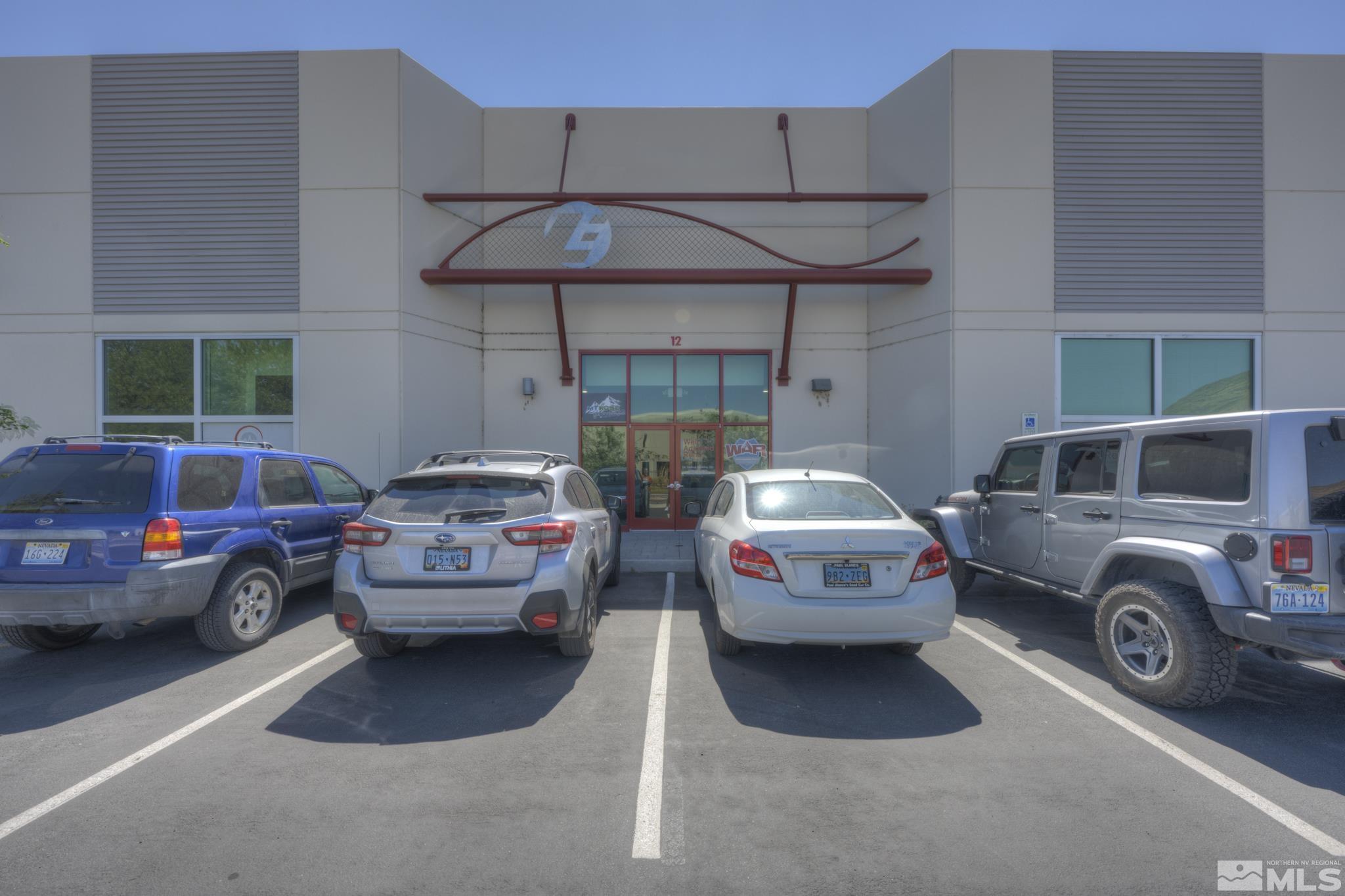 8975 Double Diamond Parkway, Unit 12A Reno, NV 89521 - Photo 8 of 8 a front view of a house with parking space