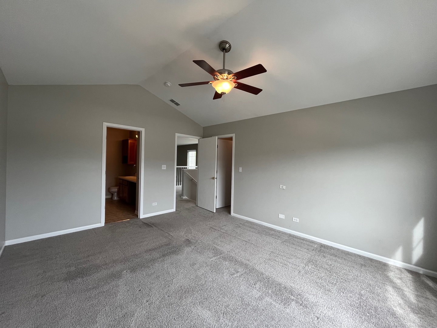 1919 Golden Gate Lane Naperville, IL 60563 - Photo 12 of 18 a view of a room with a ceiling fan and a window