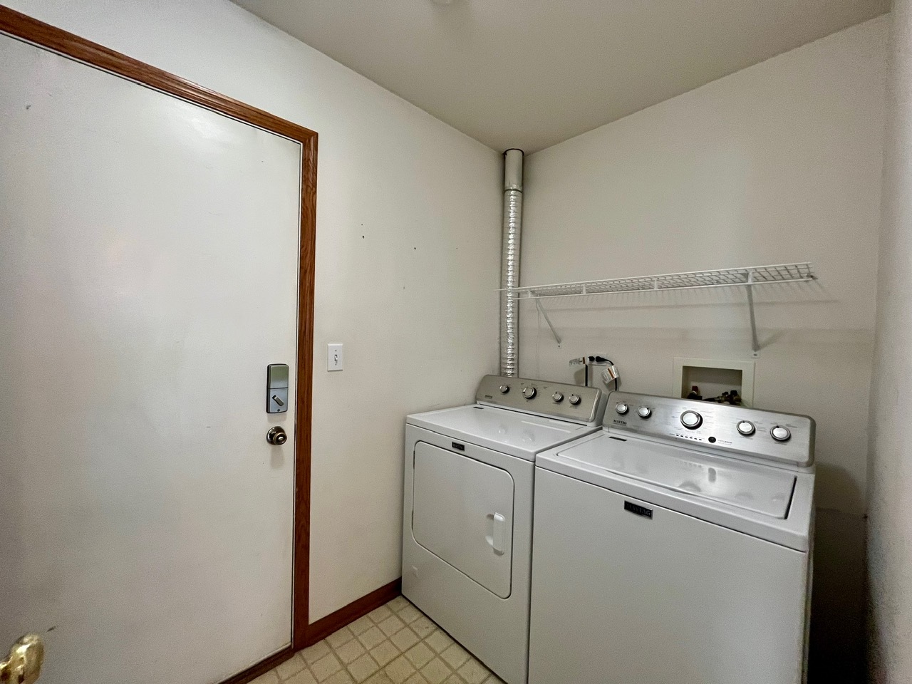 1919 Golden Gate Lane Naperville, IL 60563 - Photo 17 of 18 a view of washer and dryer with bathroom in the background