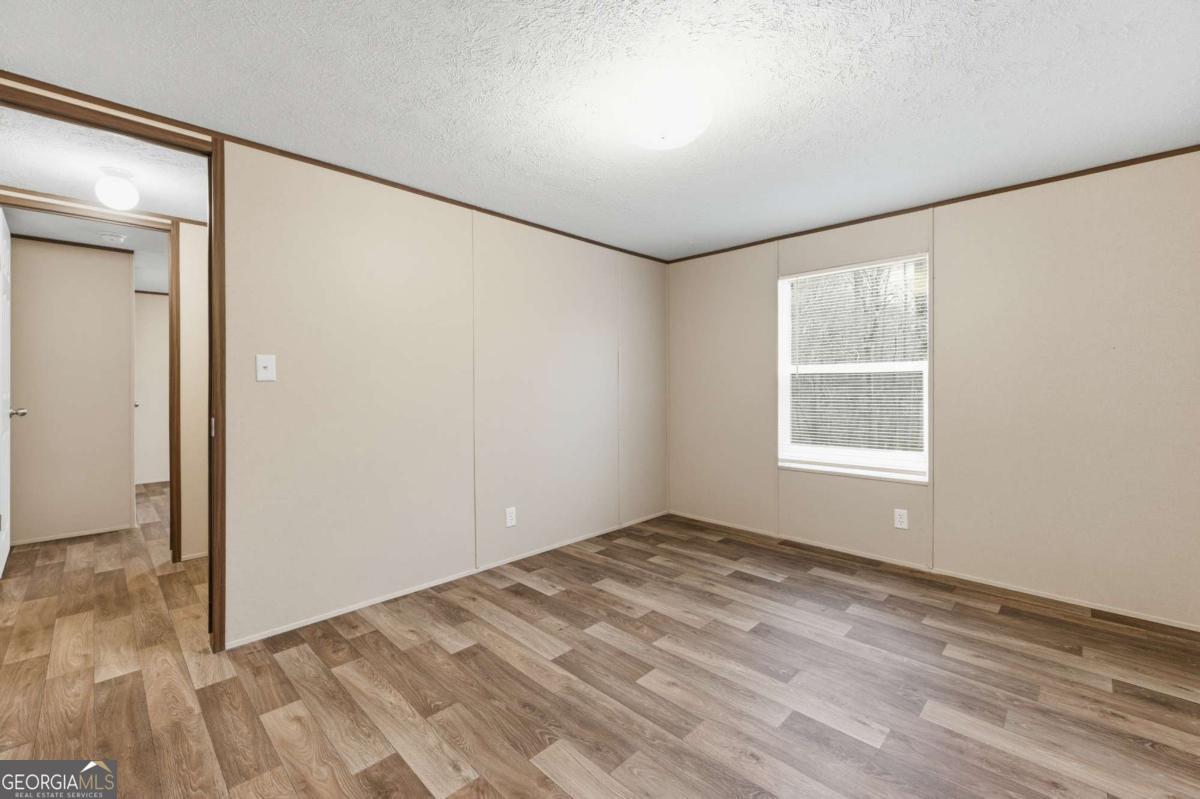 2232 Grandview Road Jasper, GA 30143 - Photo 16 of 29 an empty room with windows and closet