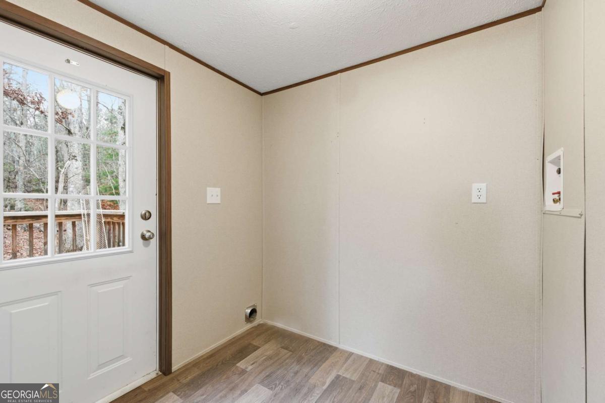 2232 Grandview Road Jasper, GA 30143 - Photo 20 of 29 a view of a small space with wooden floor and a window