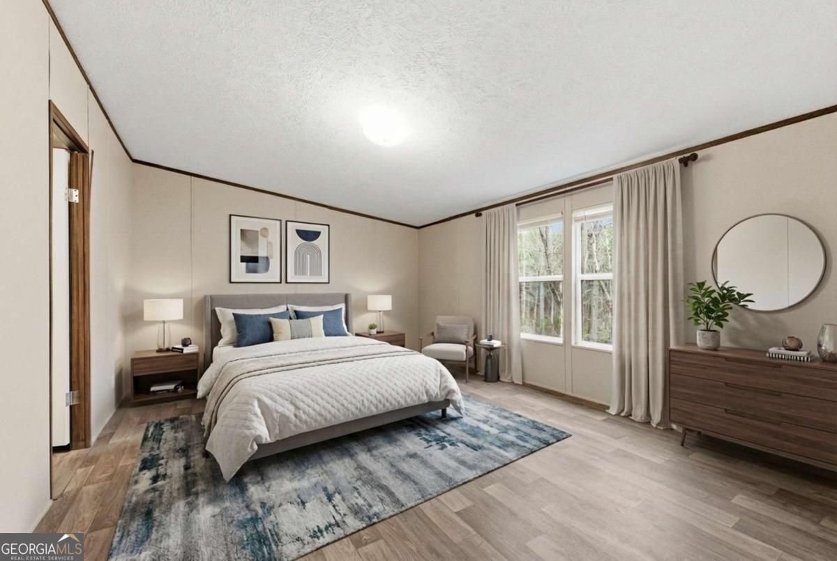2232 Grandview Road Jasper, GA 30143 - Photo 6 of 29 a bedroom with a large bed and a window