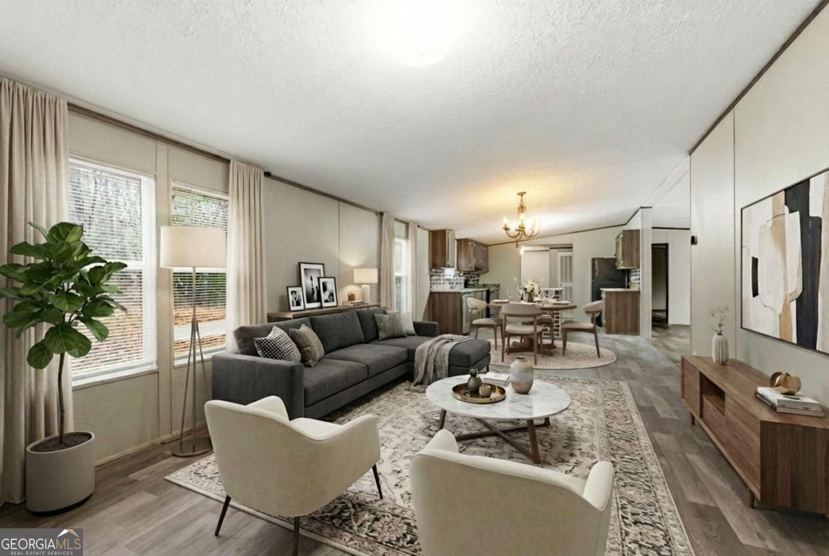 2232 Grandview Road Jasper, GA 30143 - Photo 10 of 29 a living room with furniture potted plant and a large window