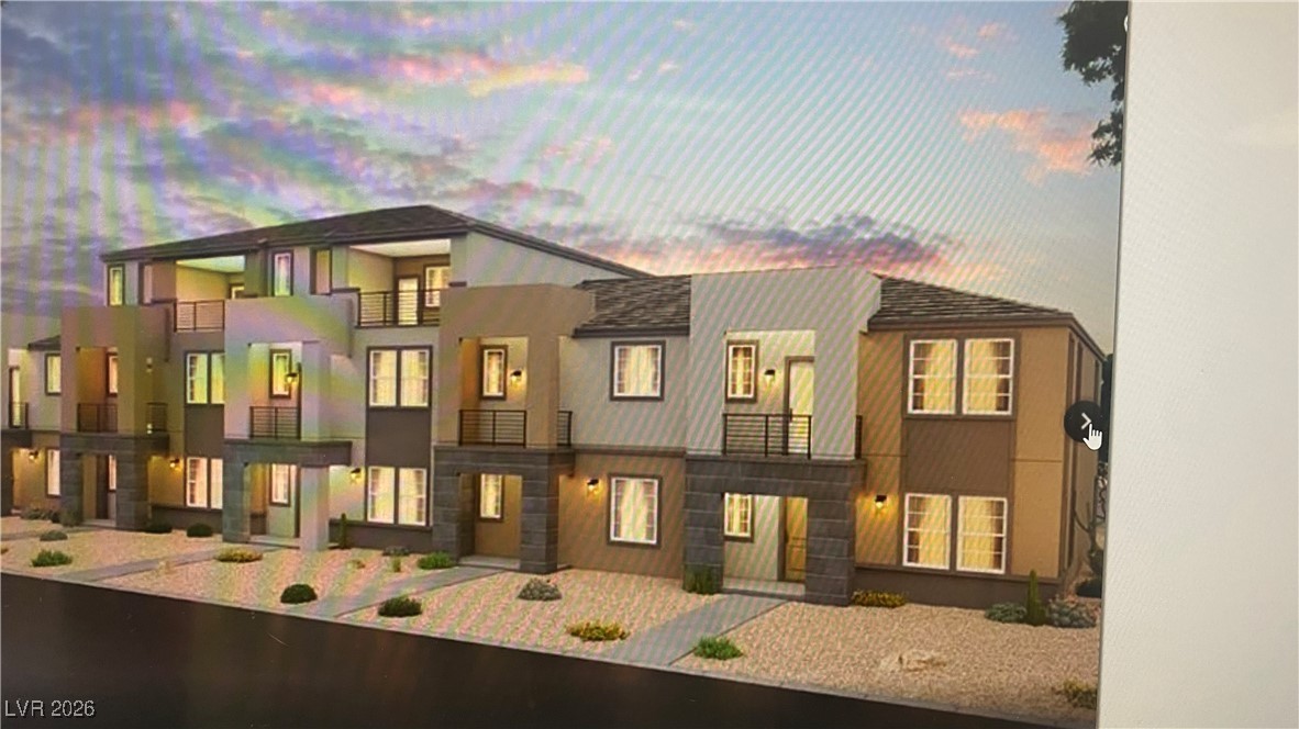 View of front of home featuring a balcony