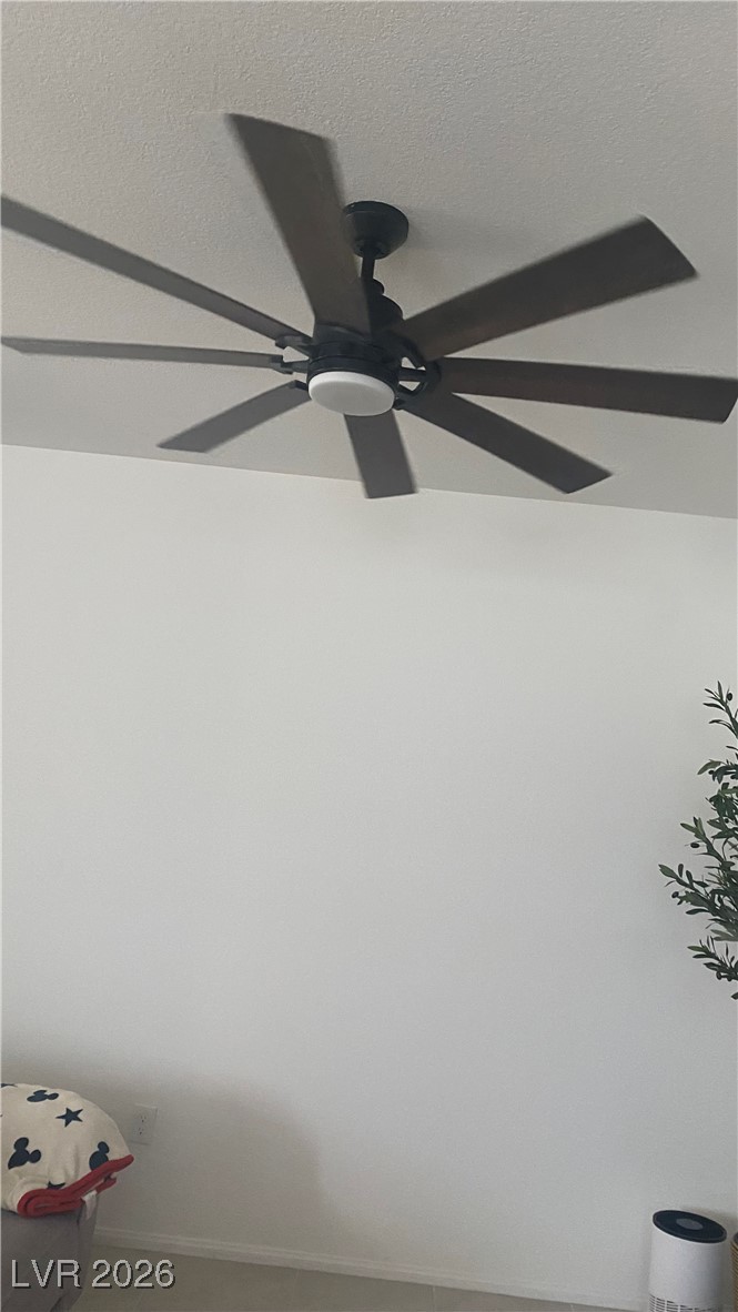 5675 Spellbinding Street Las Vegas, NV 89148 - Photo 12 of 18 Detailed view of a ceiling fan and a textured ceiling