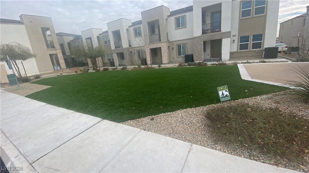5675 Spellbinding Street Las Vegas, NV 89148 - Photo 16 of 18 View of home's community with a yard and a residential view