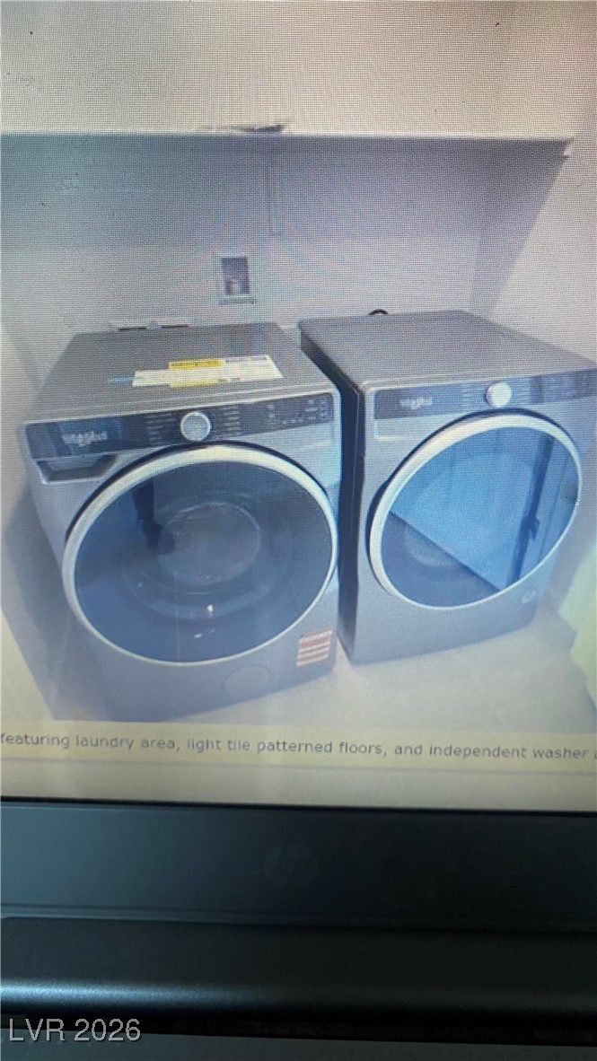 5675 Spellbinding Street Las Vegas, NV 89148 - Photo 5 of 18 Laundry area featuring separate washer and dryer