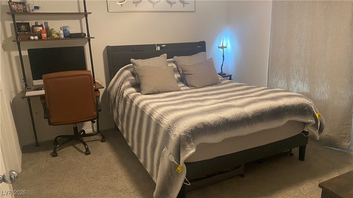 5675 Spellbinding Street Las Vegas, NV 89148 - Photo 7 of 18 Bedroom featuring light colored carpet