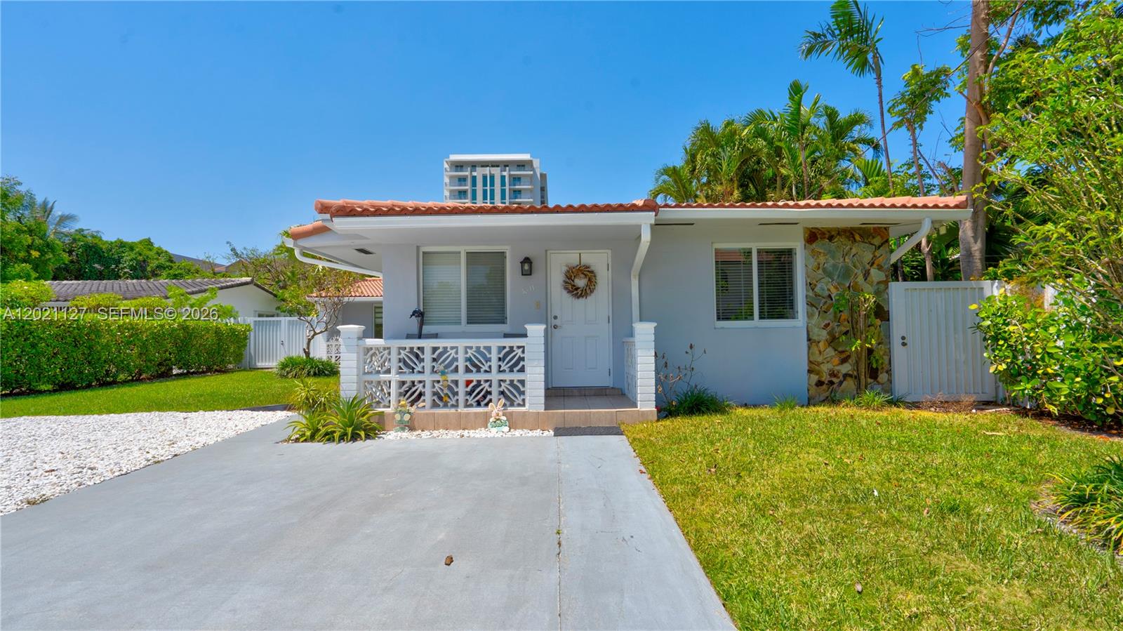 3611 Southwest 23rd Street Miami, FL 33145 - Photo 37 of 56 3611 - front porch & entrance for 2/1 rented unit. Side gate on right is the private access from this property to side yard leading to exterior access from kitchen and laundryroom. No access from front to back unit