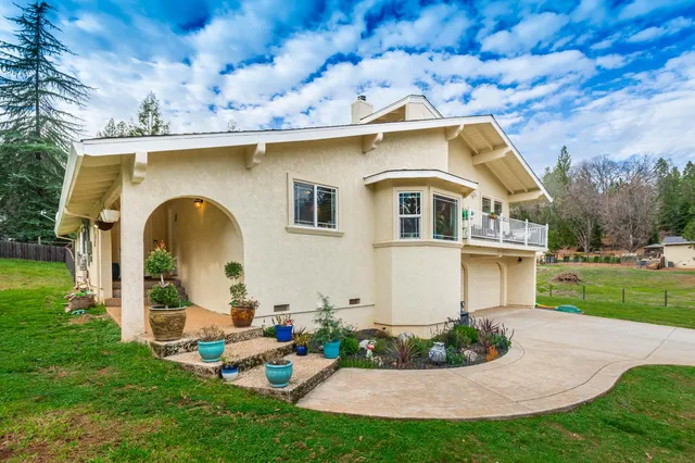 a large kitchen with stainless steel appliances granite countertop a sink and cabinets