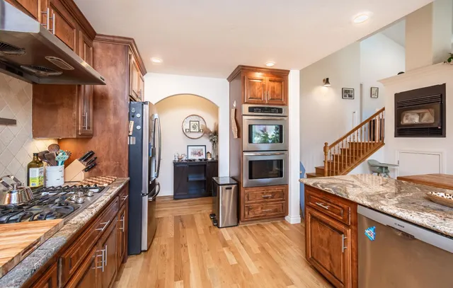 a view of a livingroom with furniture and a flat screen tv