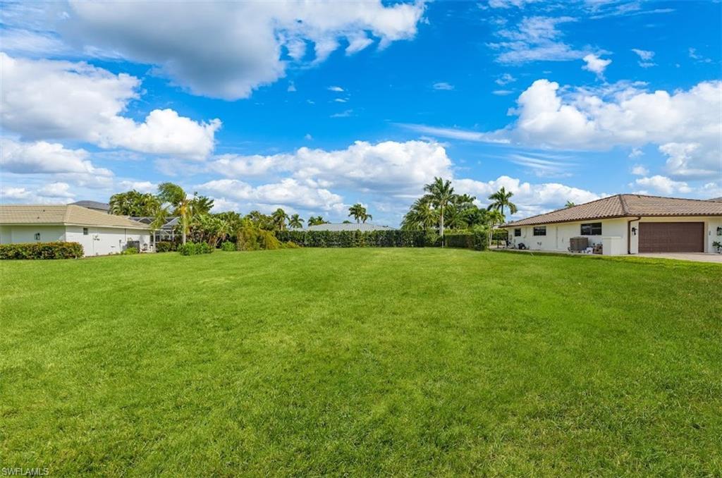4228 Crayton Road Naples, FL 34103 - Photo 2 of 13 a view of an house with backyard space and balcony