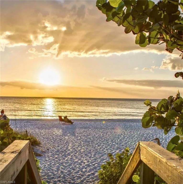 4228 Crayton Road Naples, FL 34103 - Photo 6 of 13 a view of an ocean and beach