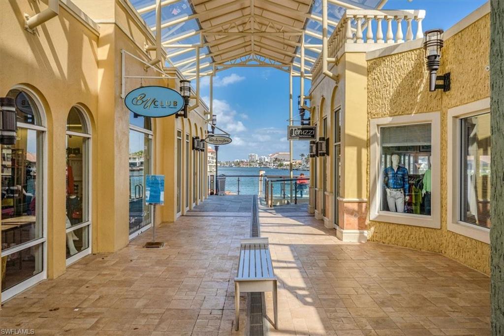 4228 Crayton Road Naples, FL 34103 - Photo 8 of 13 a front view of a building with street view