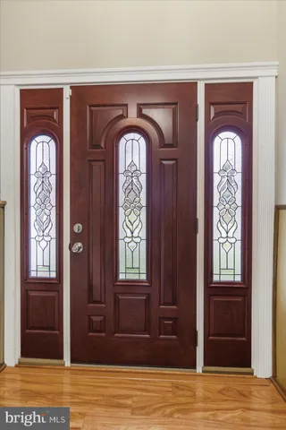 a front view of a door and wooden floor
