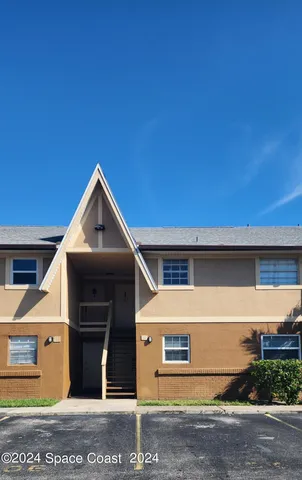 a front view of a house with garage