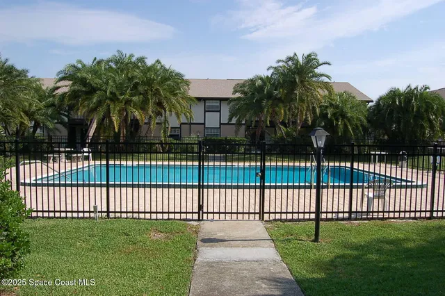 a view of a yard and a fence