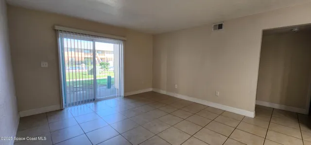 a view of an empty room and window