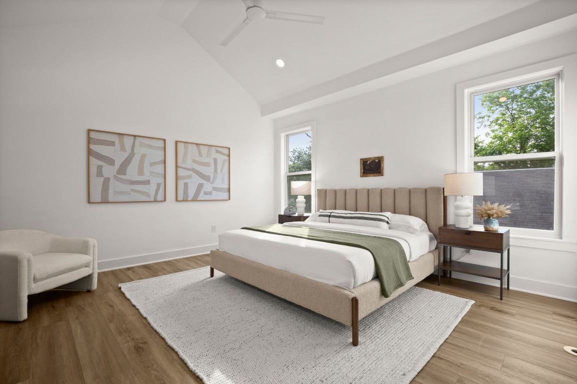 1912 Madison Avenue Austin, TX 78757 - Photo 6 of 17 a bedroom with a bed lamp and a window